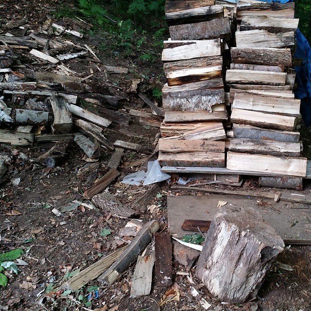 piles of wood are stacked on each other