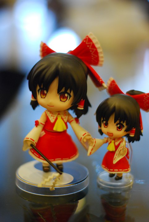 a figurine of two girls holding hands