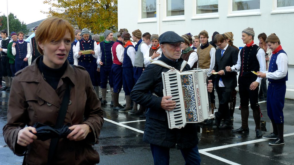 a woman with red hair is playing an accordion