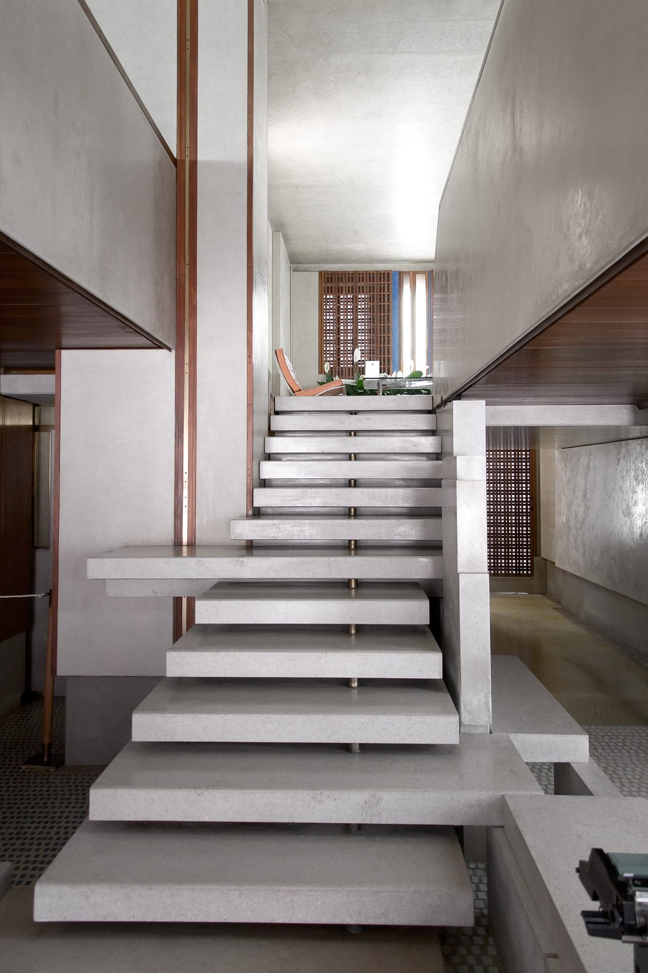 a set of white stairs leading up to a very long area