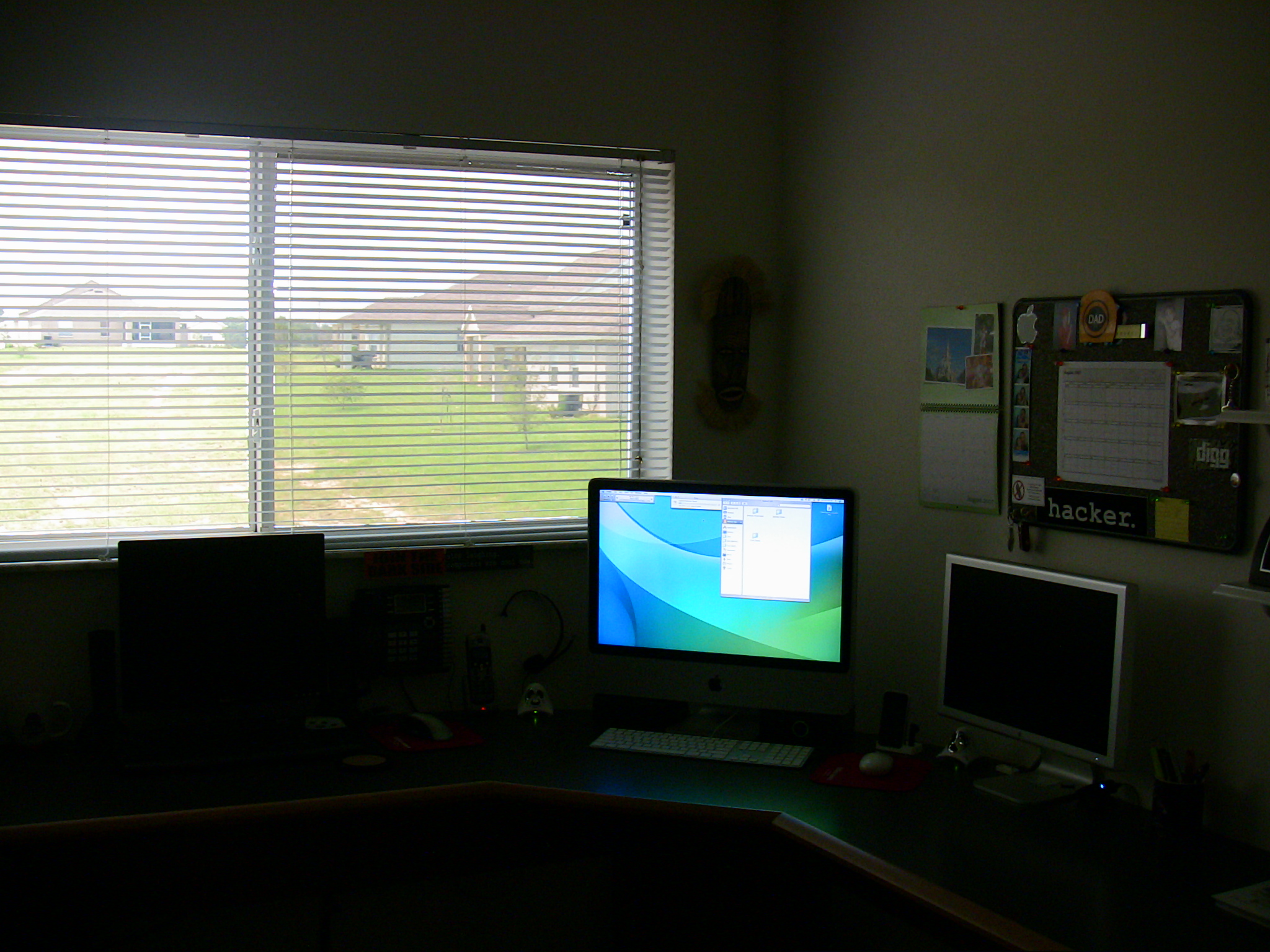 the office desk with two computers at one