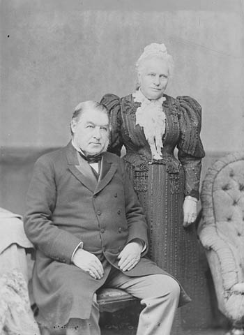an old po of two people in formal wear
