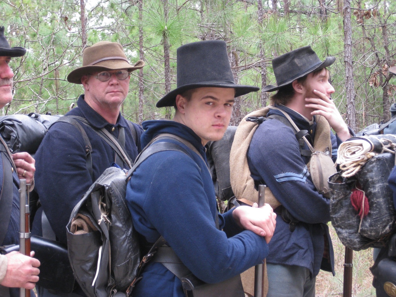 a group of people in hats and clothing