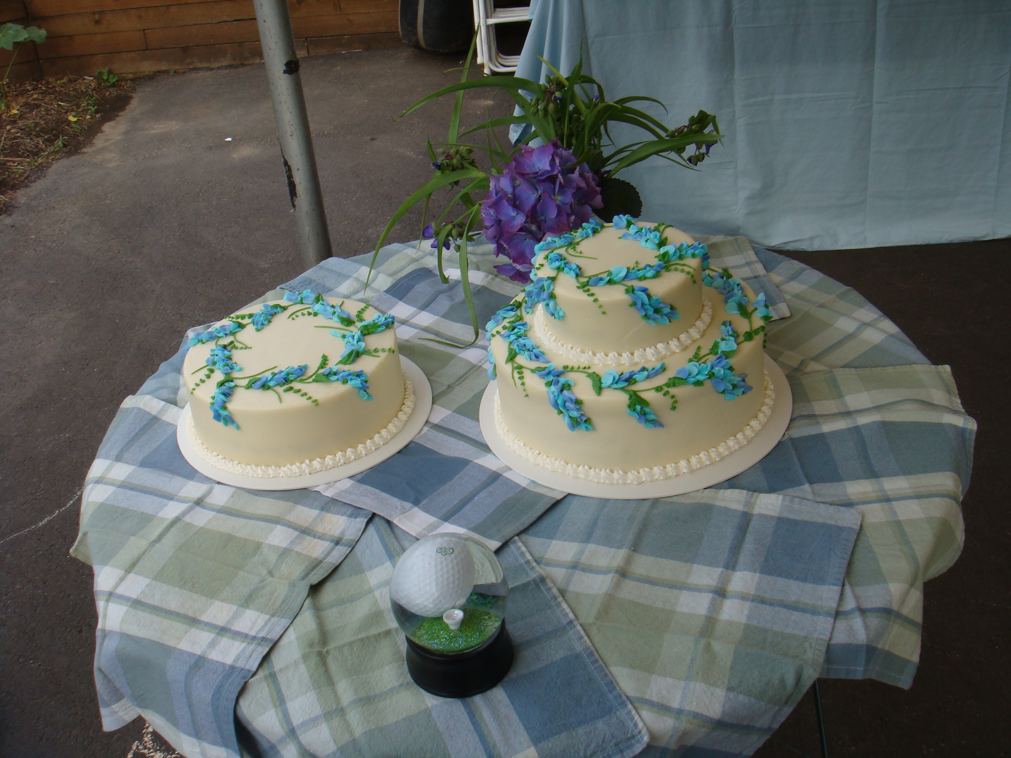 a pair of wedding cakes are on a table
