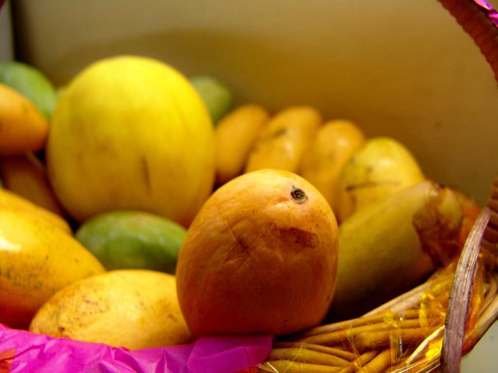 some fruit in a basket on a table