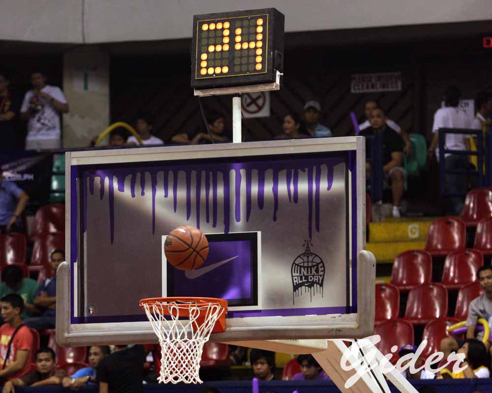 the backboard is decorated with purple paint