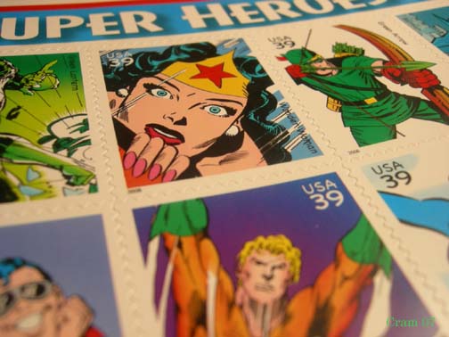 postage with comics written on them is displayed