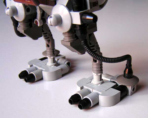 there are two lego robot legs on a table