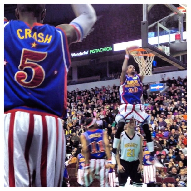 some basketball players playing basketball on the court