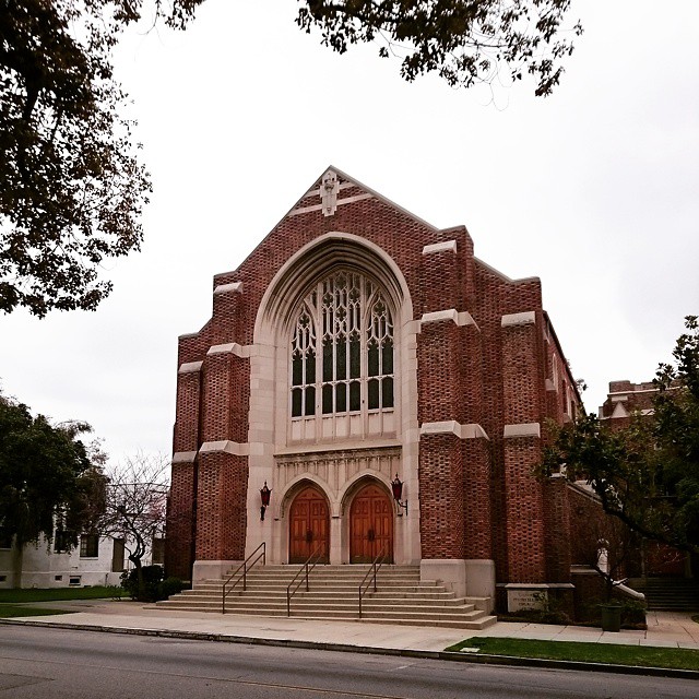 a large church with a tower and door in it