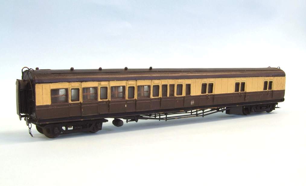 the old model train is brown and yellow