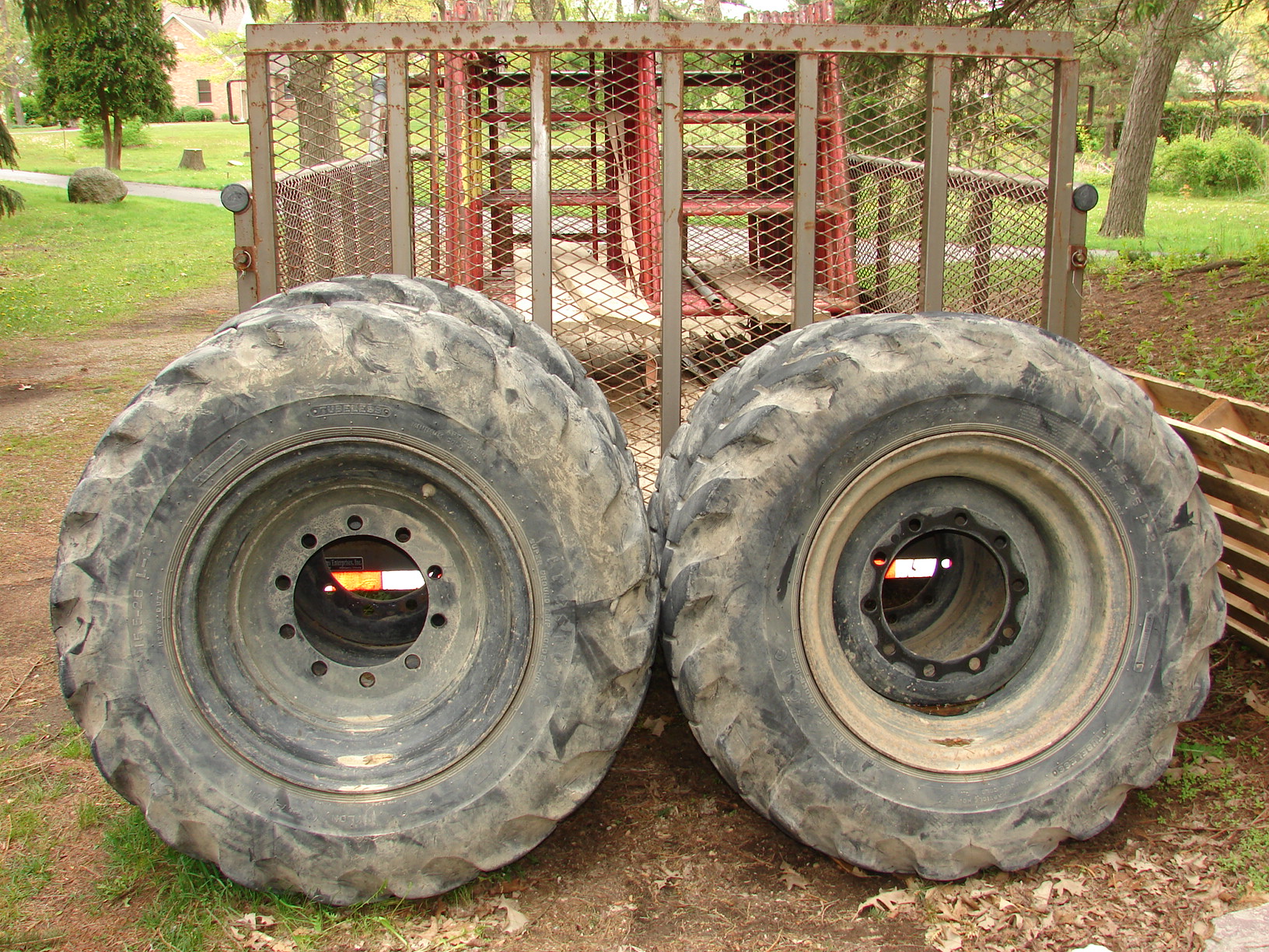 there are two big tires by the gate