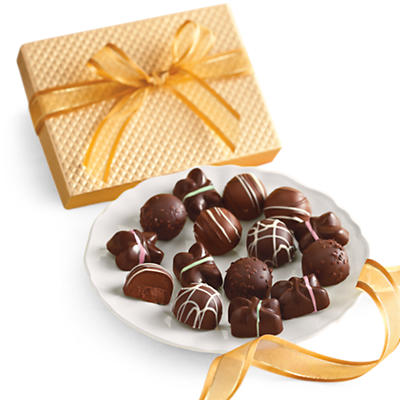 plate of assorted chocolates with a yellow bow around it