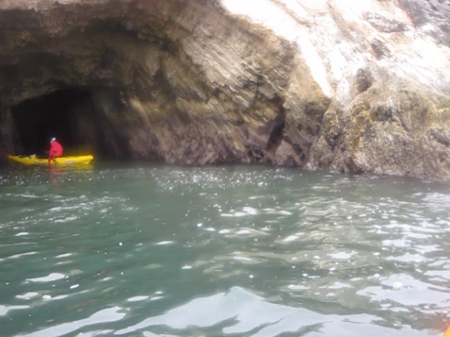 a person in a boat in a cave