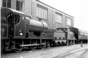 an old black and white po of two trains