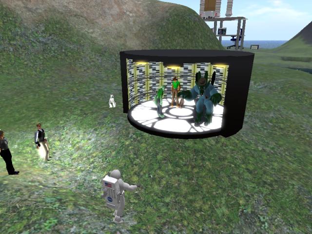 two people stand near a computer generated 3d scene