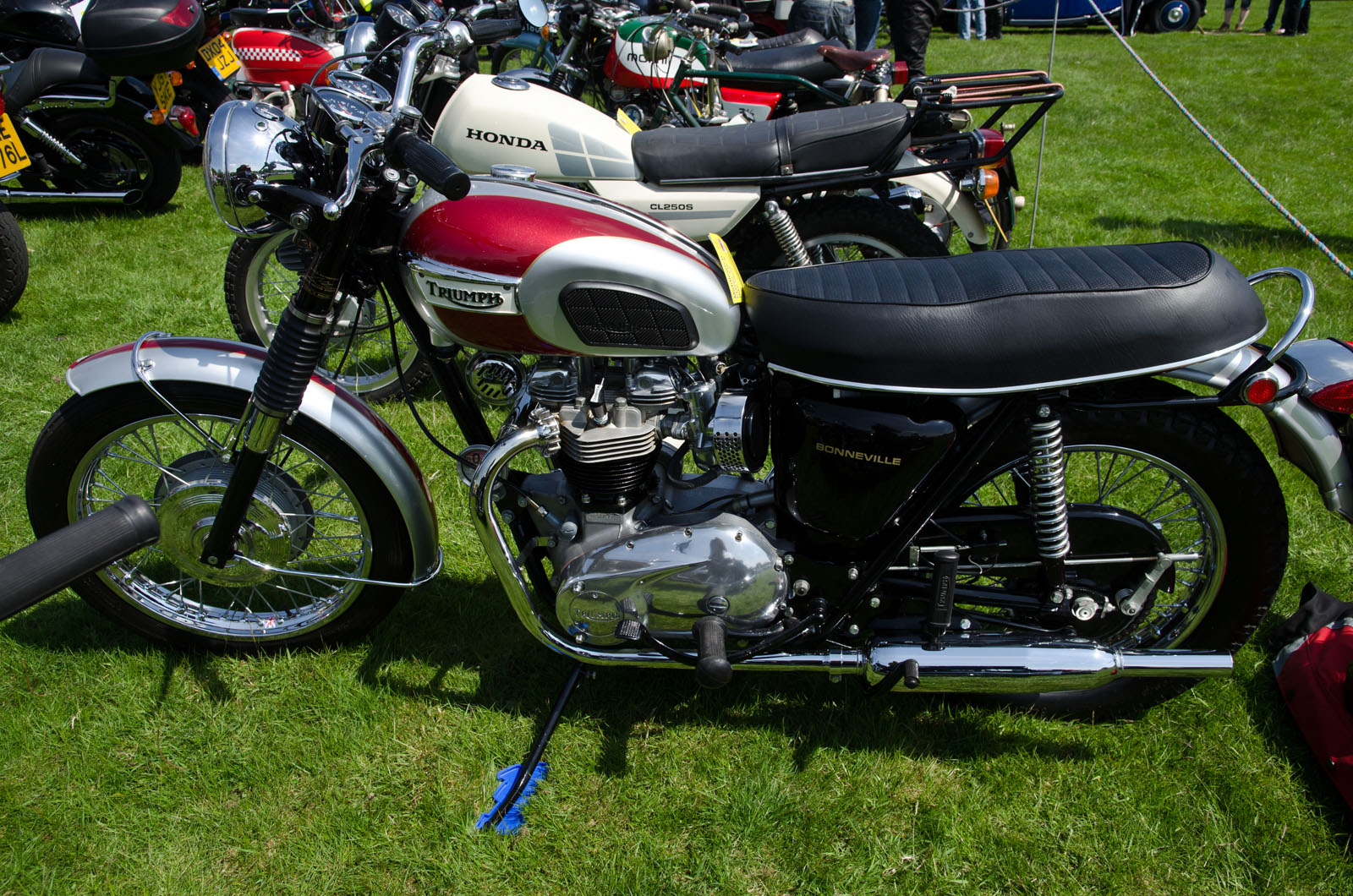 an old style motorcycle on display at an event