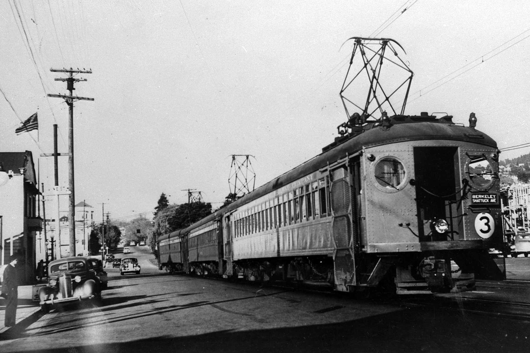 a train moving on tracks in a city street