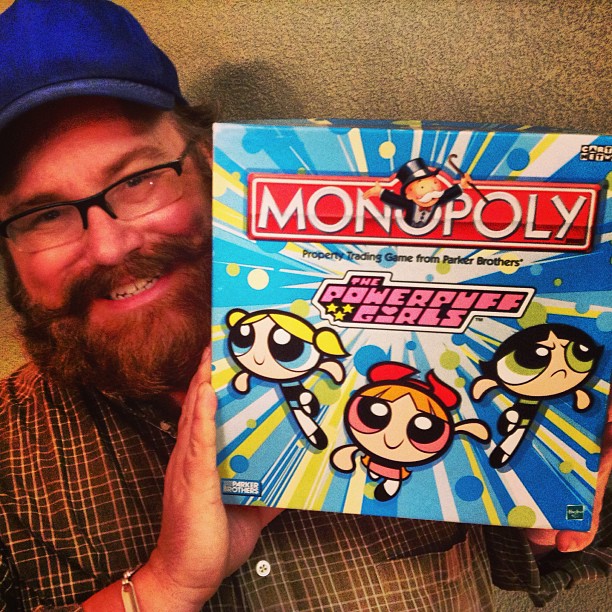 man holding up board game that was released from monopoly