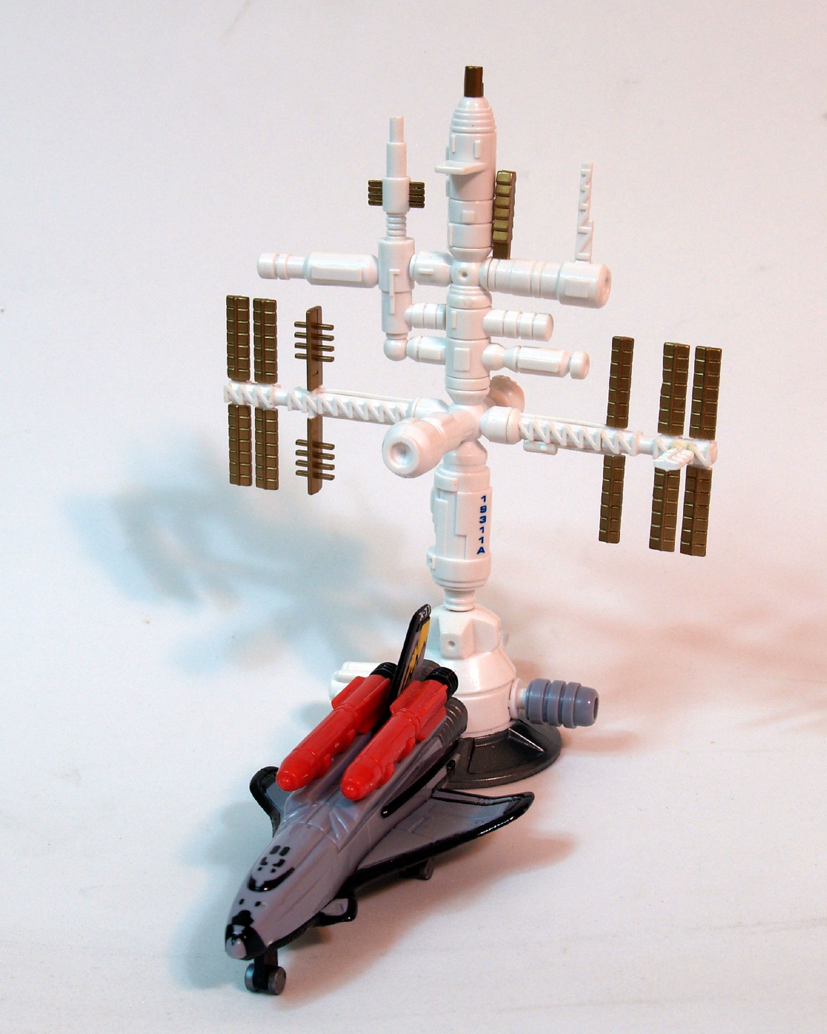 a lego car next to a space rocket