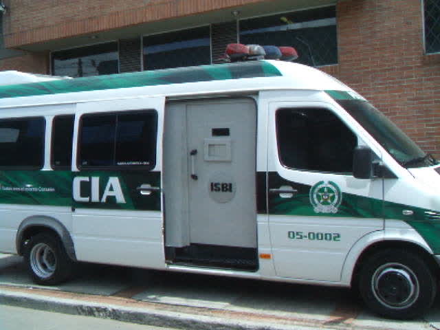 an ambulance with an entrance is parked near the curb