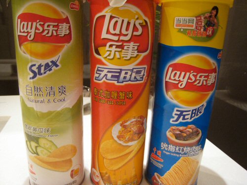 a couple of rolls of lays are on a counter