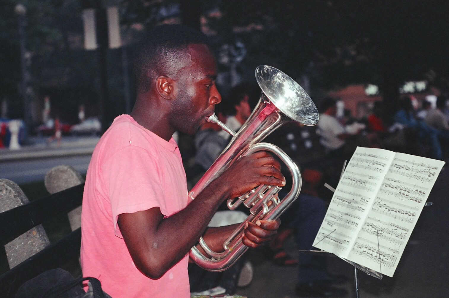 the trumpet player is playing music outside