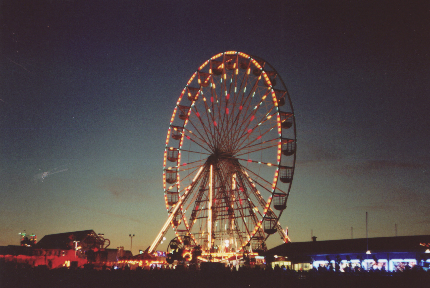 an amut park with lots of ferris wheels