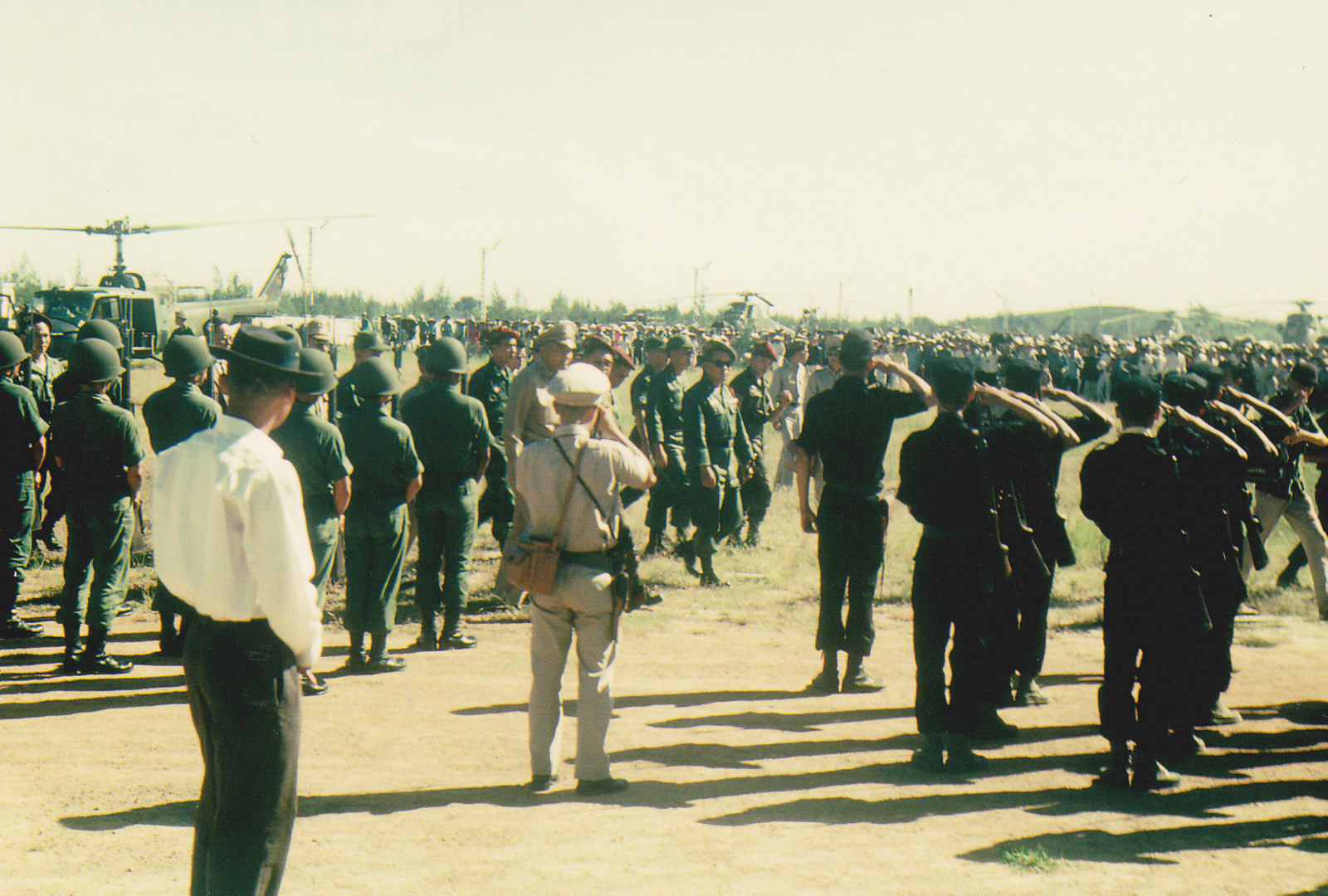 a man is standing in front of soldiers