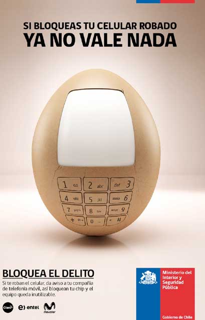 a cell phone sits in a small round wooden object