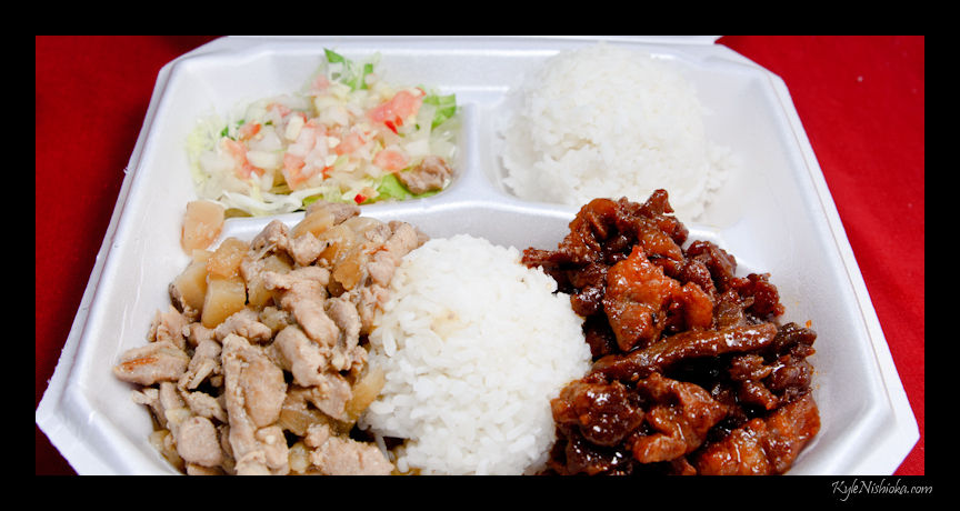 a takeout container contains rice, meat and vegetable