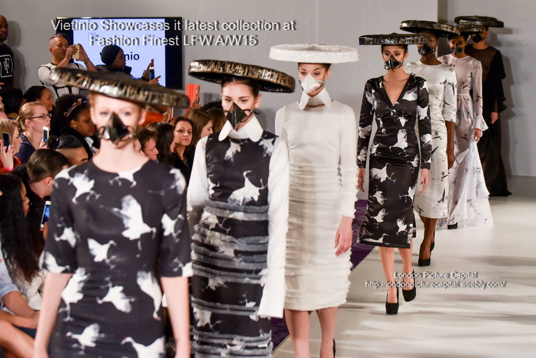 models wearing white and black with masks on their heads