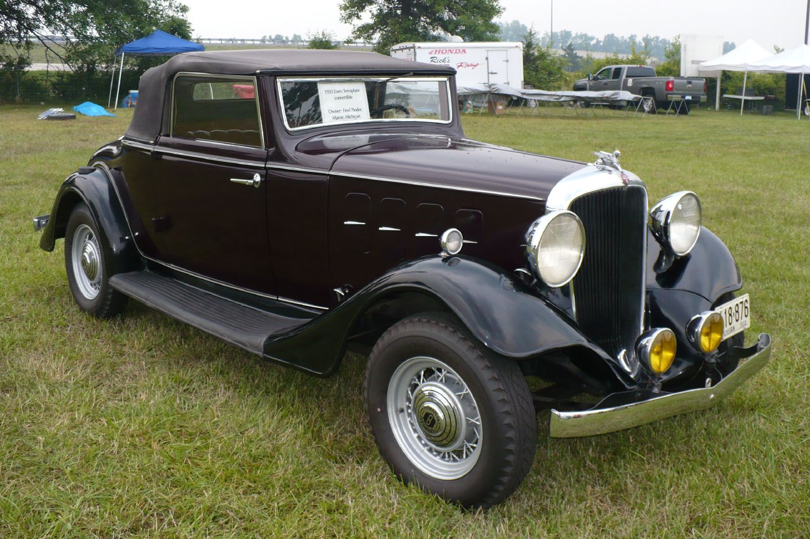 a classic style car is displayed at the show