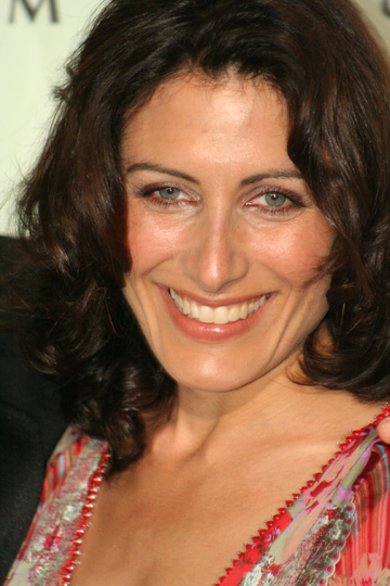 a smiling woman is posed for the camera