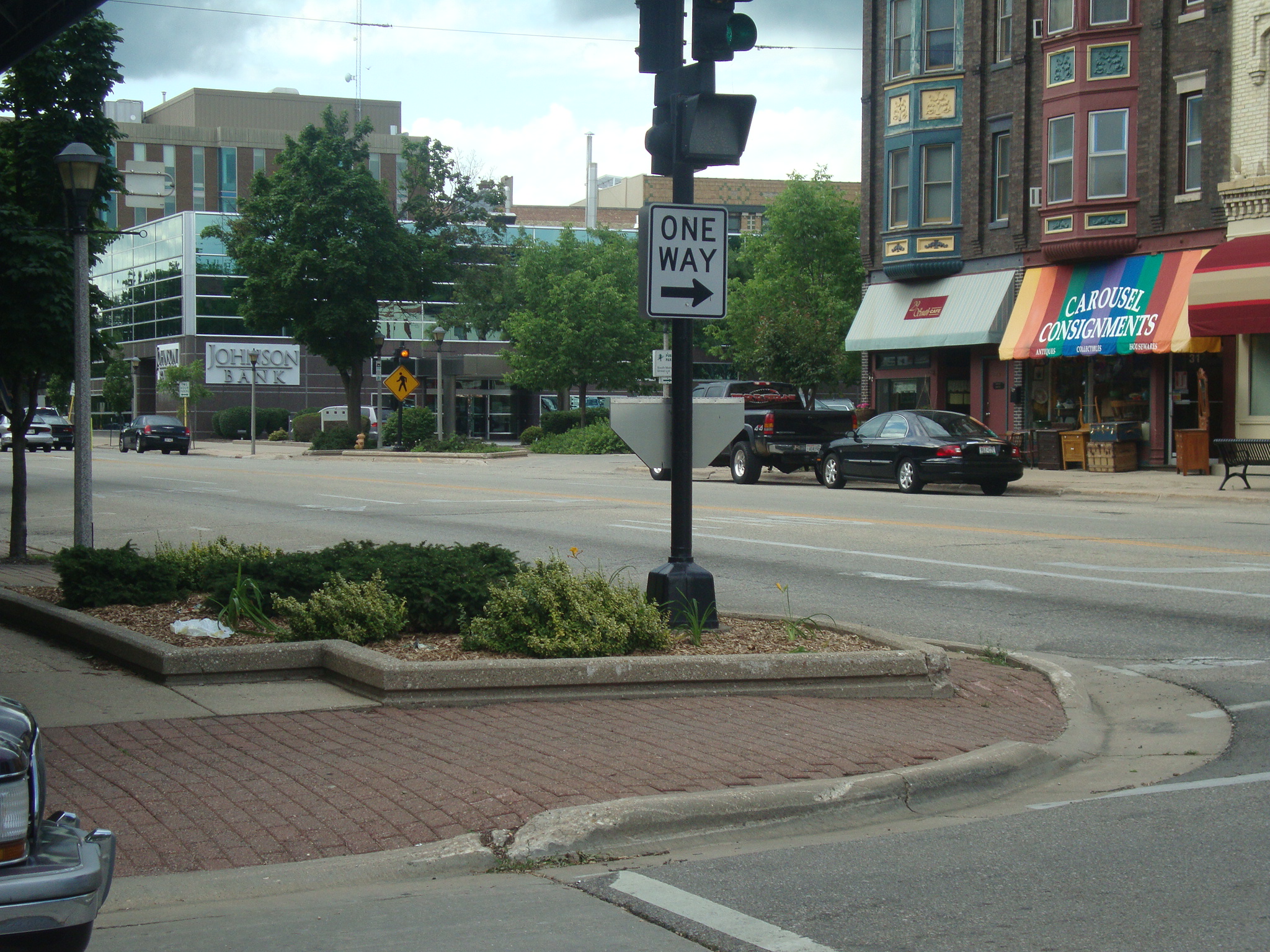 a city street with buildings and cars on it