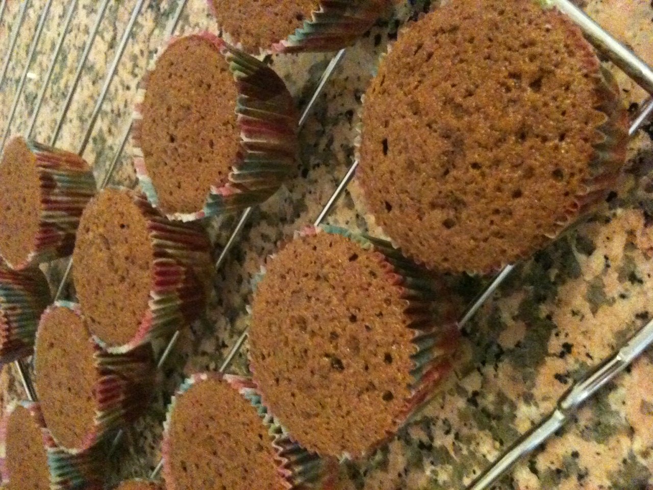 a wire rack with muffins on top of it