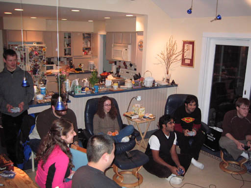 people gathered in the living room to watch soing on television