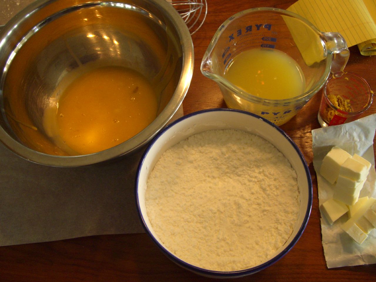 the ingredients for an orange cake are placed on a table