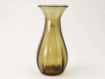 an antique glass vase is shown against a white background