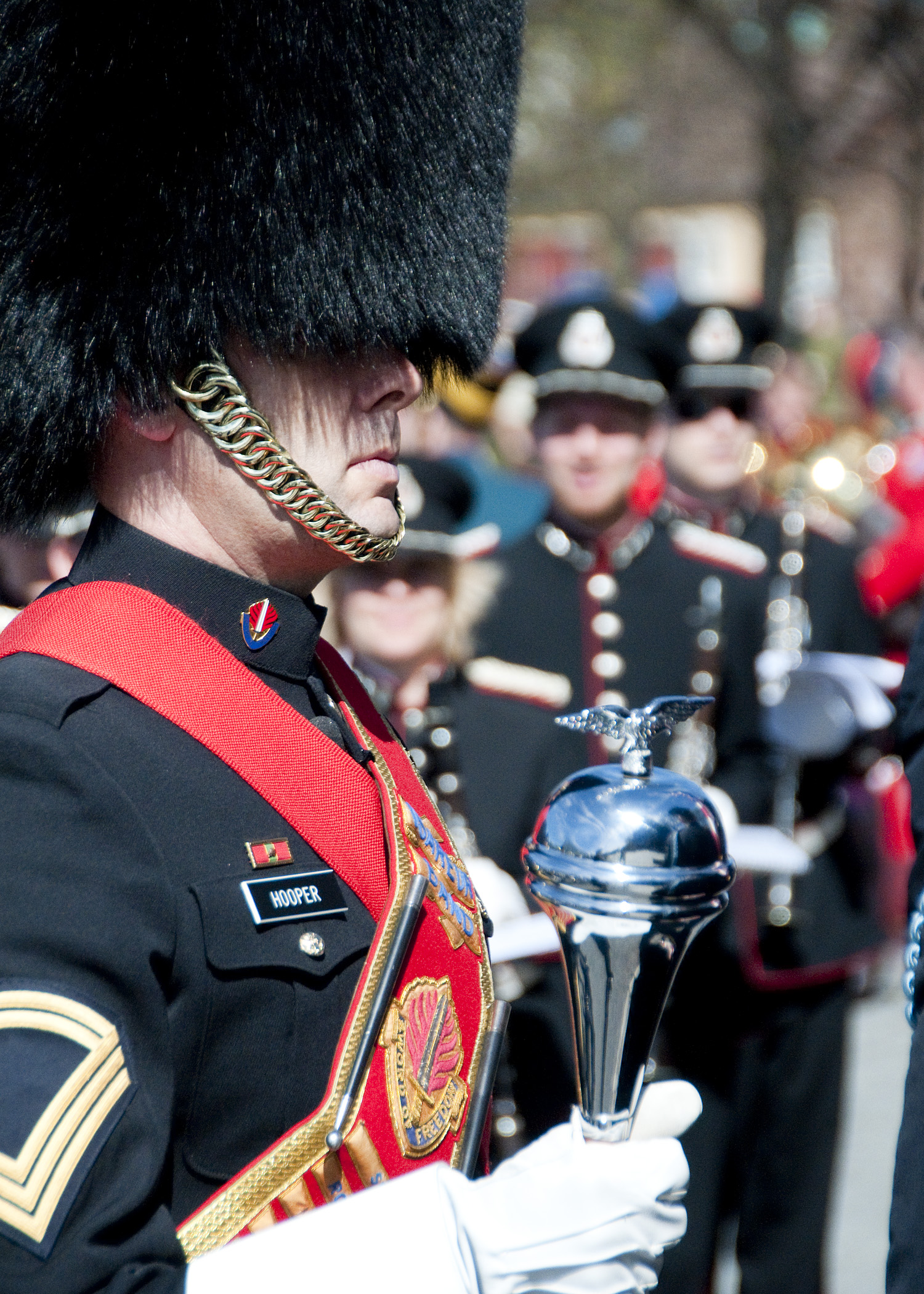 the pipe guards and drummer are marching down the street