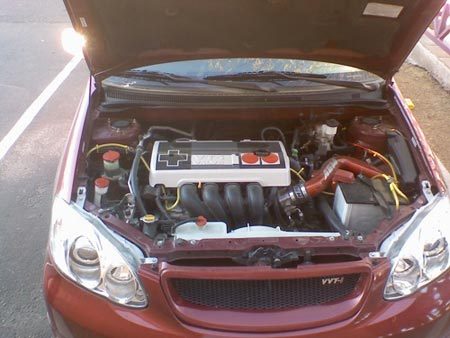 the engine of a red car is installed in the trunk