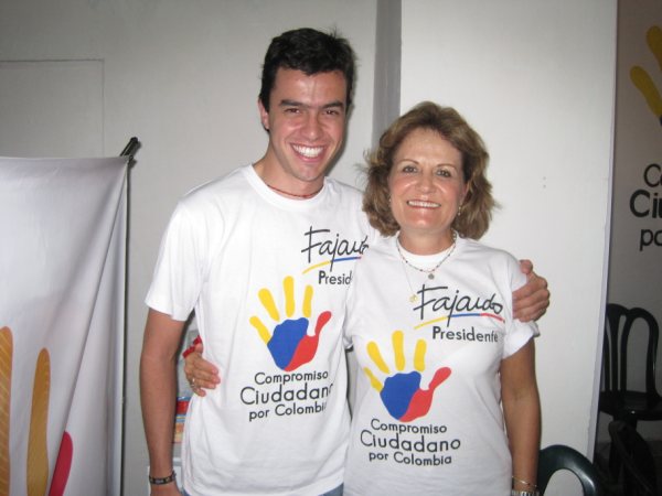 a man and woman in t - shirts pose for a picture