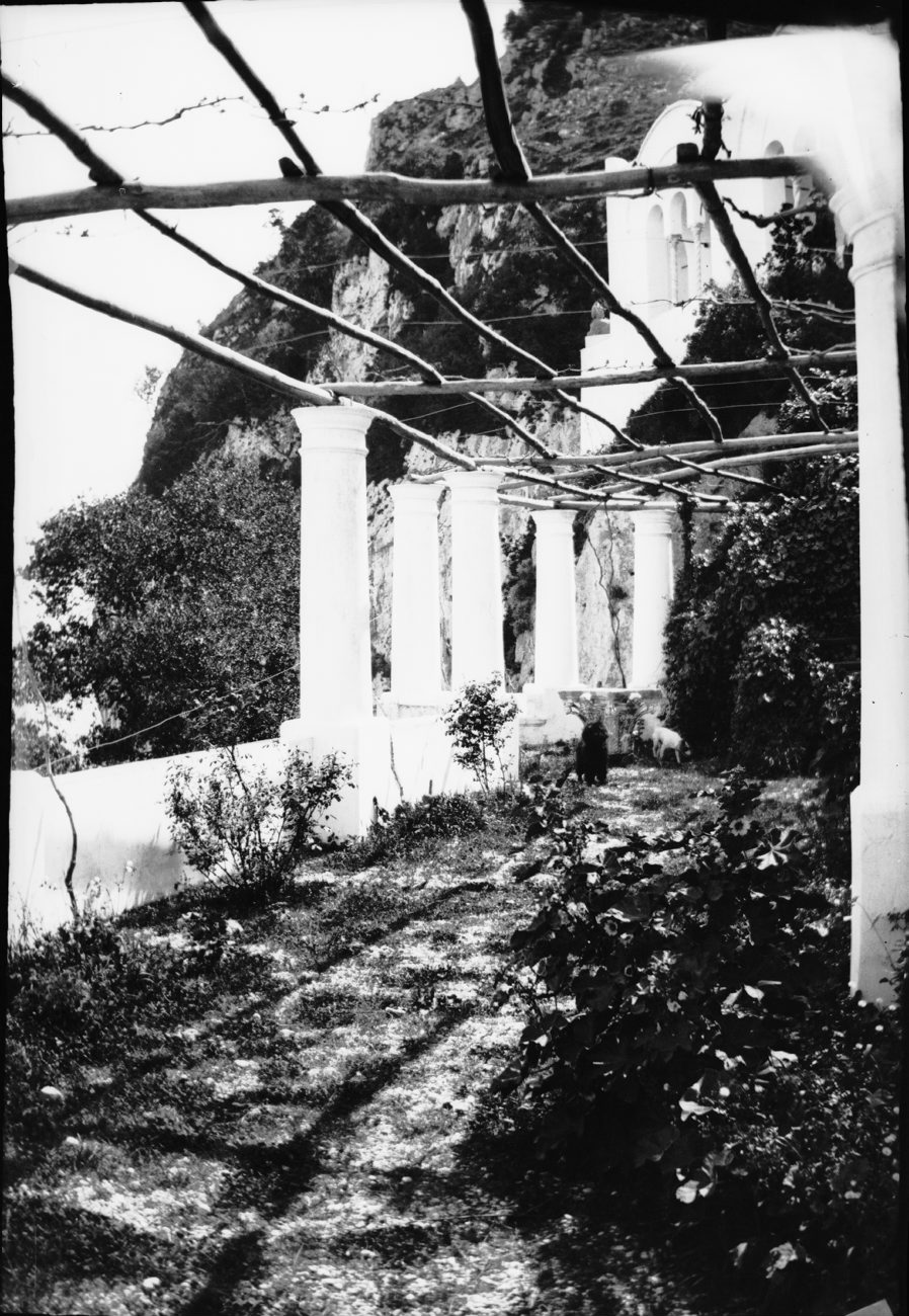 a building with an archway with steps going up to it