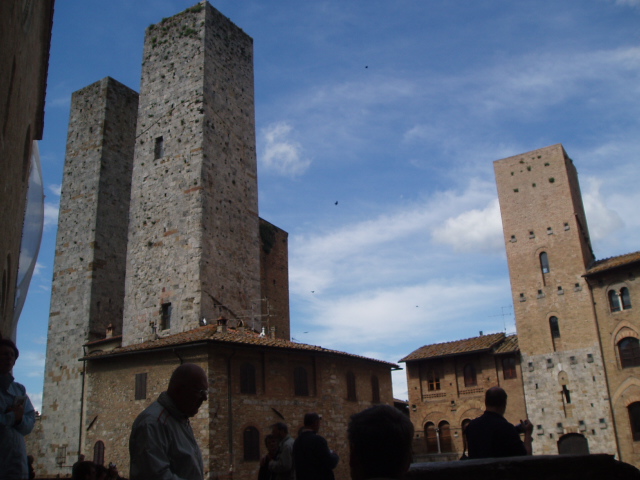 a group of people standing around a large tower