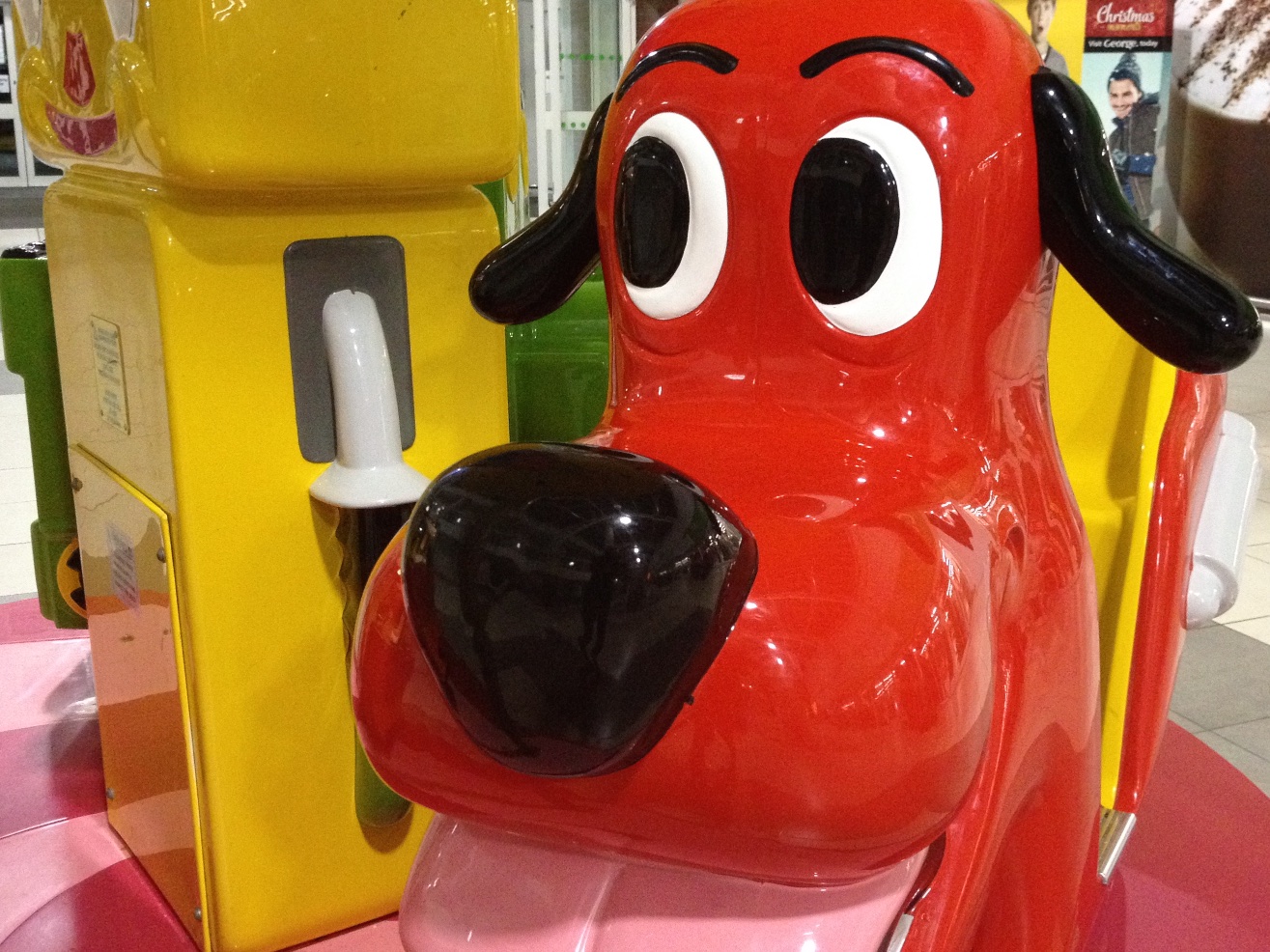 there is a large red dog statue in the shape of a toy