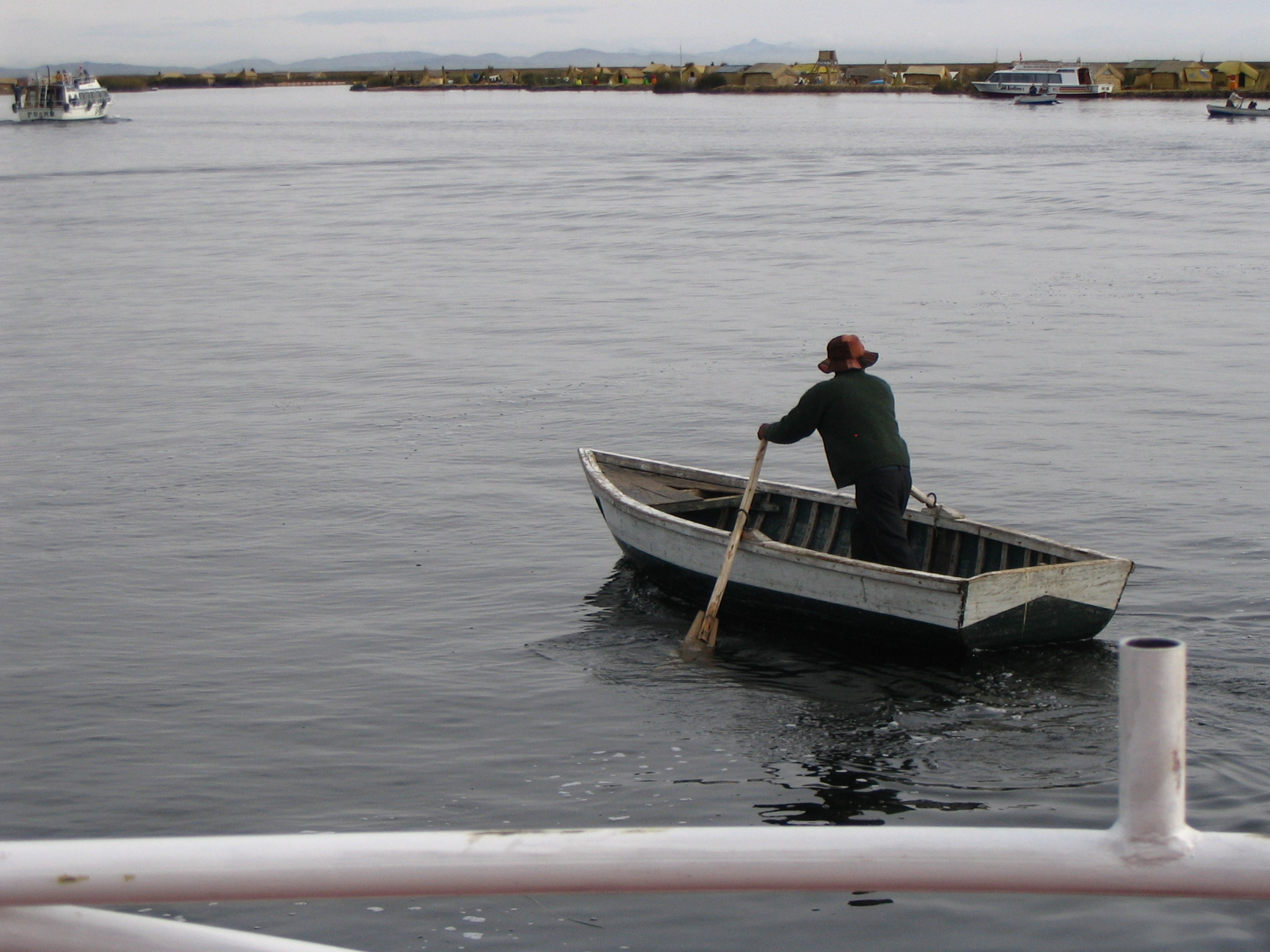 a man sits in his boat in the water