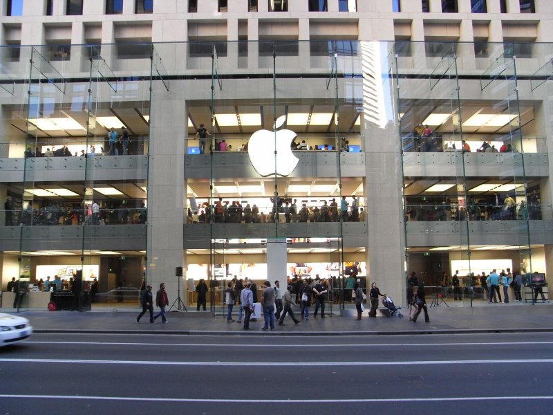 a building with people walking in front of it