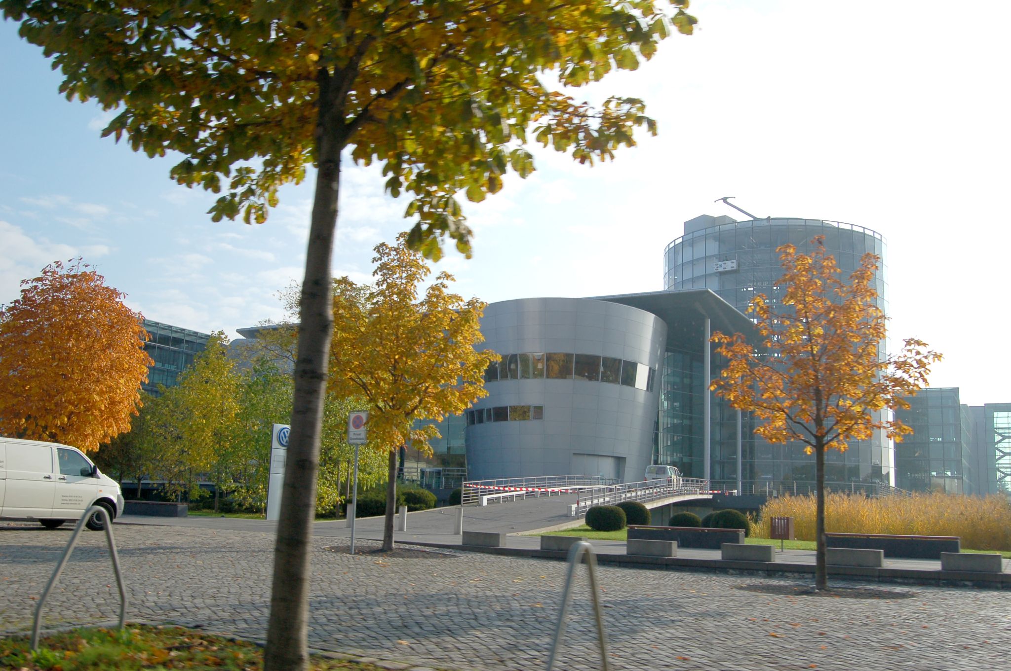 the building is by itself, surrounded by the trees