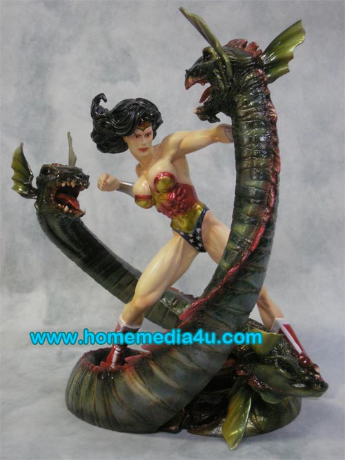 dc comics statue of a girl on a dragon