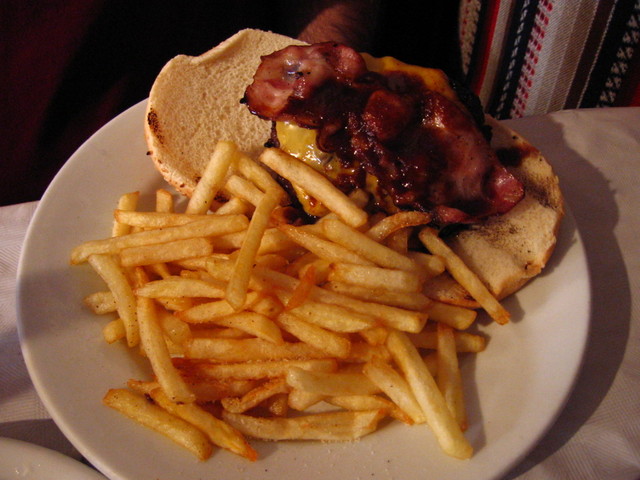 the plate has french fries on it and a sandwich